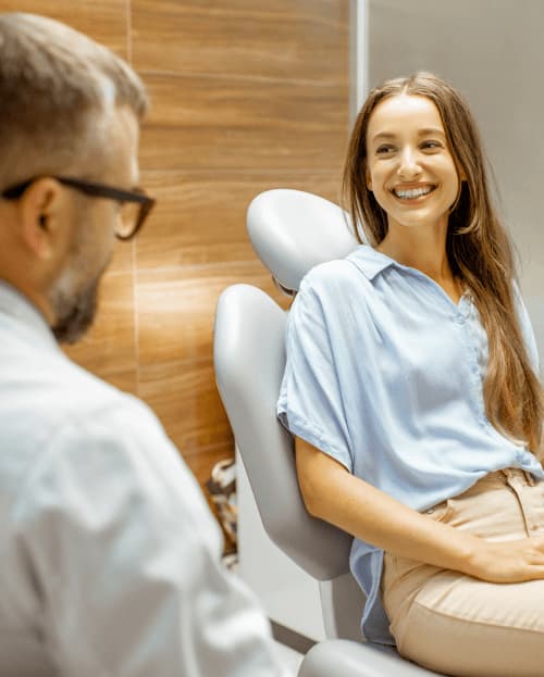 Adult female in orthodontic office smiling during consultation