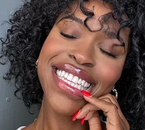 Real Smile Express patient Tia T. smiling with aligners in
