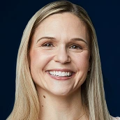 Smiling adult female patient after treatment